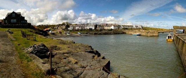 Craster village behind the harbour