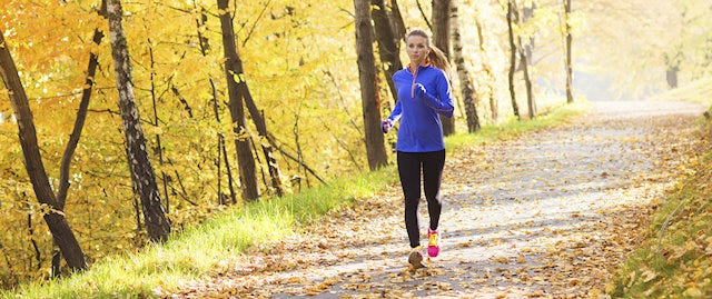 A lady running in Autumn