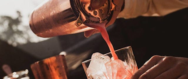 Cocktail being poured from a shaker