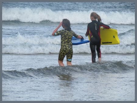 kids doing watersports in the sea