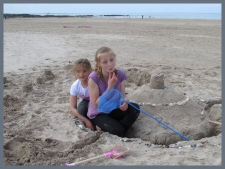 kids building sandcastles