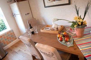 A welcome tea tray Dining table with fruit and flowers